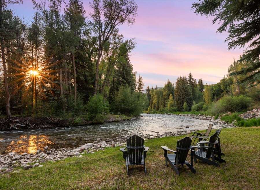 Experience serene living with this stunning property featuring a tranquil riverfront setting.