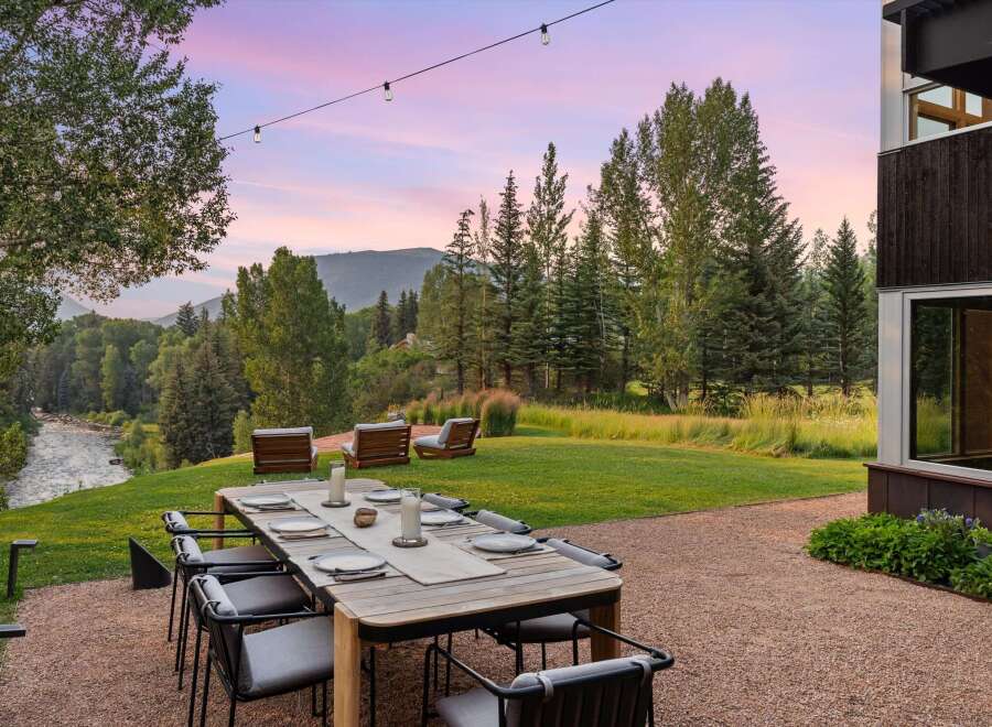 Experience breathtaking mountain views from this stunning outdoor dining area, perfect for al fresco entertaining.