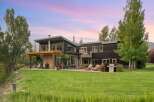 Experience modern luxury in this stunning contemporary home, featuring expansive windows that capture breathtaking sunset views.