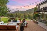 Experience breathtaking mountain views from this stunning outdoor living space, perfect for entertaining or relaxing.