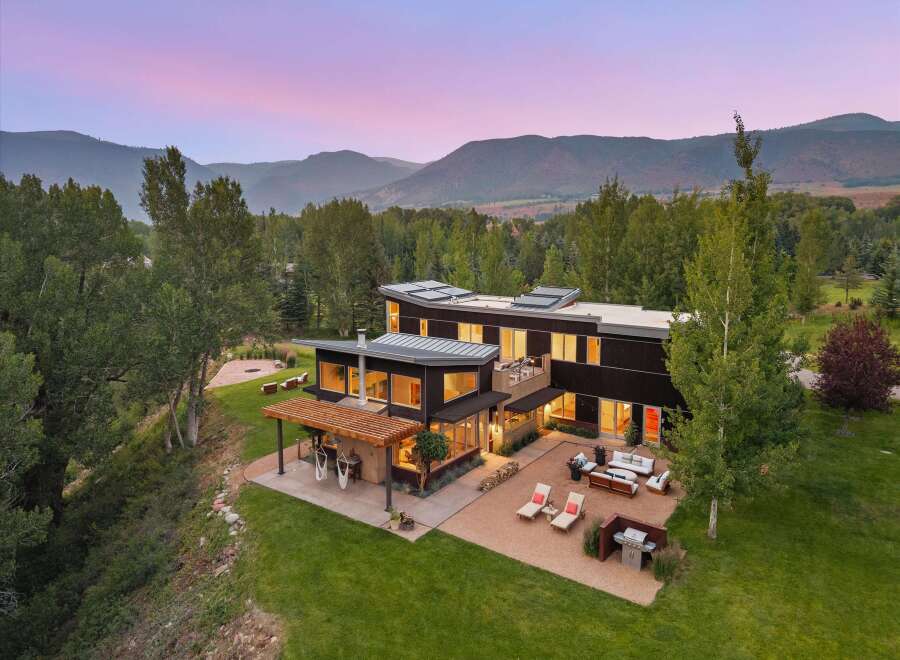 Experience modern luxury in this stunning contemporary home, nestled amidst breathtaking mountain views.
