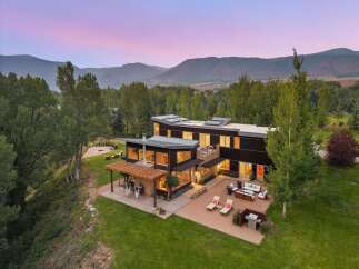 Experience modern luxury in this stunning contemporary home, nestled amidst breathtaking mountain views.