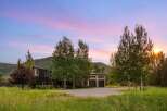 Experience the serene beauty of this modern mountain home, nestled amidst lush greenery and rolling hills.