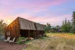 Experience rustic charm and modern luxury with this stunning property featuring a vintage barn and a contemporary home.