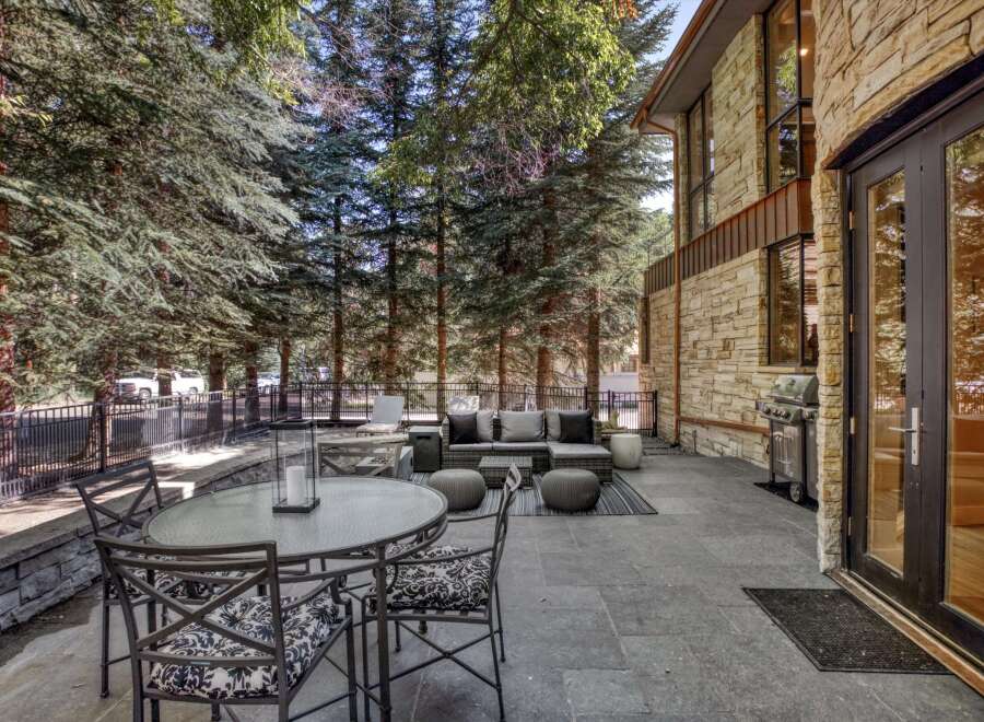 Enjoy outdoor living on this spacious stone patio, perfect for entertaining.
