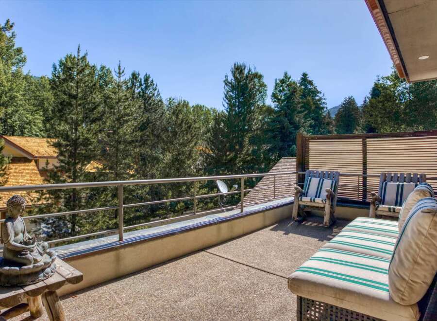 Enjoy the serene mountain views from this expansive deck, perfect for outdoor relaxation and entertaining.