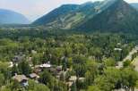 Nestled amidst lush greenery and towering trees, this stunning property offers a serene escape with breathtaking mountain views.