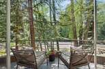 Enjoy serene moments on this charming balcony, offering a tranquil retreat amidst lush greenery.