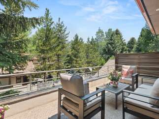 Enjoy the serene mountain views from this spacious balcony, perfect for outdoor relaxation and entertaining.
