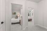 Step into a bright and airy hallway featuring two inviting bedrooms.