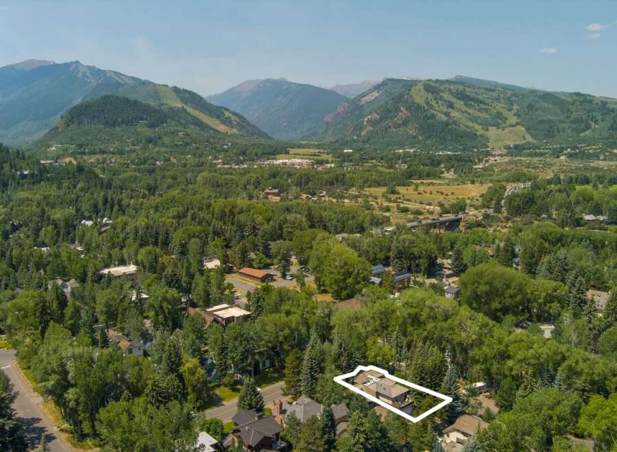 Nestled amidst lush greenery and mature trees, this property offers a serene mountain retreat.