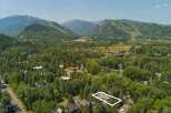 Nestled amidst lush greenery and mature trees, this property offers a serene mountain retreat.
