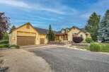 Discover this stunning home featuring a welcoming facade with a multi-car garage and a beautifully landscaped entrance.