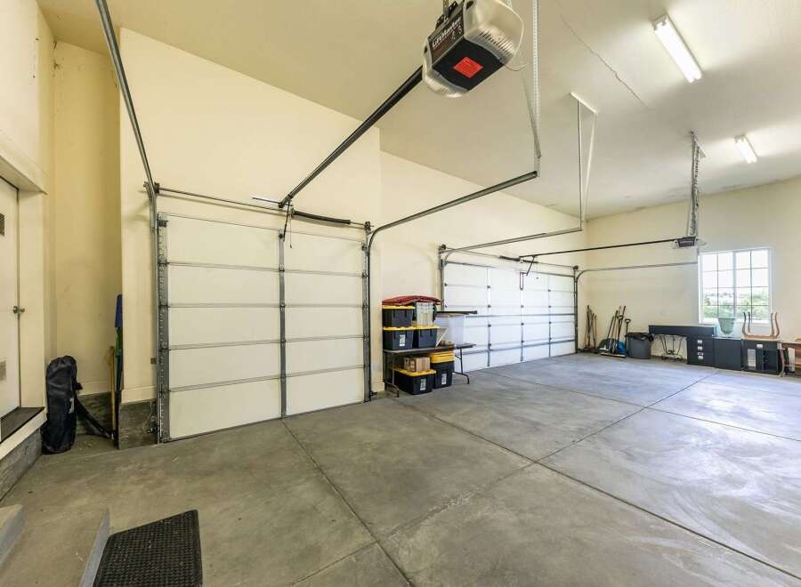 This spacious garage offers ample room for multiple vehicles and storage.