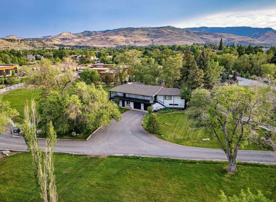Discover this stunning property nestled amidst lush greenery and rolling hills, offering a serene retreat.