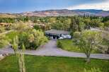 Discover this stunning property nestled amidst lush greenery and rolling hills, offering a serene retreat.