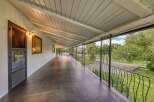 Enjoy the expansive covered porch of this charming property, offering a perfect blend of indoor-outdoor living.