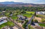 Experience luxury living in this expansive estate, featuring a modern home with a stunning pool and spa, surrounded by lush greenery and picturesque mountain views.