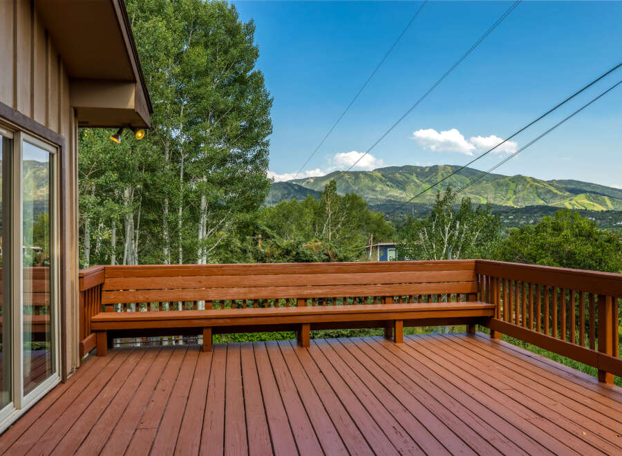 Enjoy breathtaking mountain views from this expansive wooden deck, perfect for outdoor entertaining or quiet relaxation.