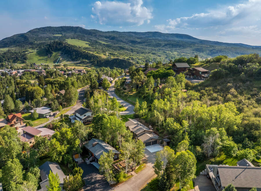 Nestled amidst lush greenery and rolling hills, this stunning property offers a serene mountain retreat.