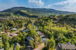 Nestled amidst lush greenery and rolling hills, this stunning property offers a serene mountain retreat.