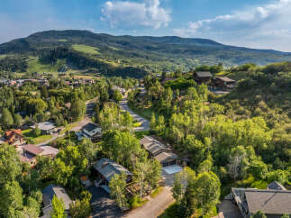 Nestled amidst lush greenery and rolling hills, this stunning property offers a serene mountain retreat.