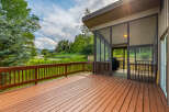 Enjoy stunning mountain views from this expansive wooden deck, perfect for outdoor entertaining.
