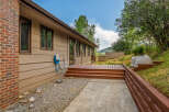 Enjoy outdoor living with this spacious deck and patio area, perfect for entertaining or relaxing.