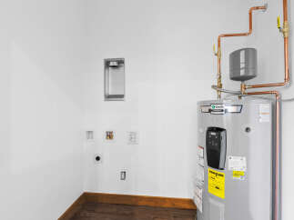 Discover modern convenience with this electric storage water heater, featuring an A.