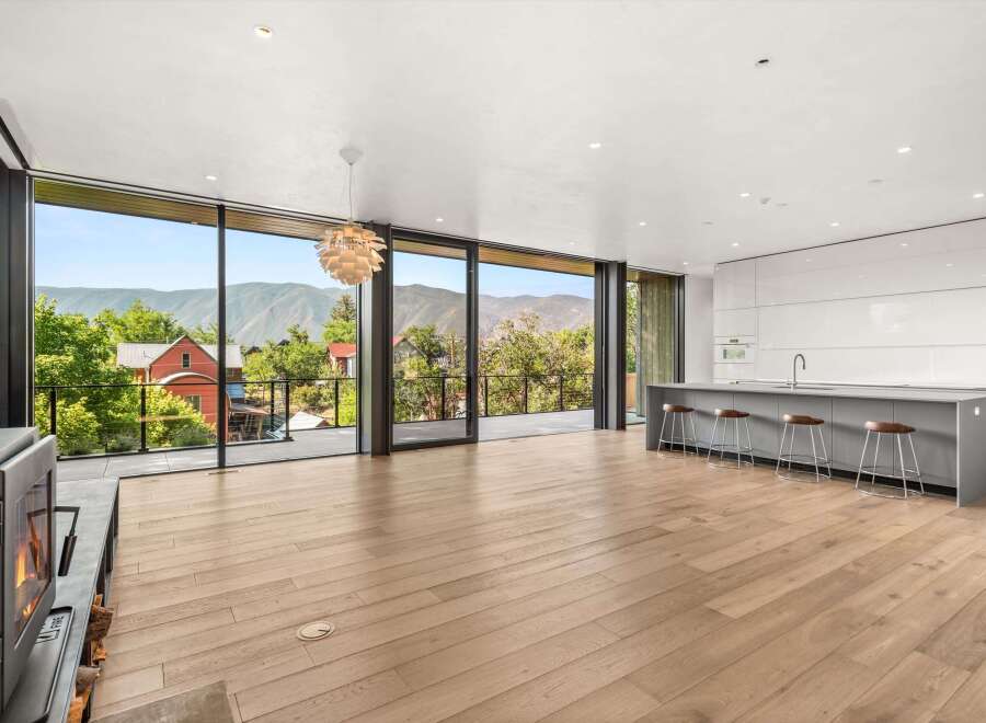 Experience modern living with breathtaking mountain views from this stunning open-concept space.