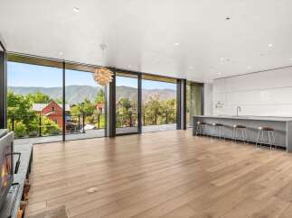 Experience modern living with breathtaking mountain views from this stunning open-concept space.
