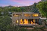 Experience modern living in this stunning architectural home nestled amidst lush greenery and rolling hills.