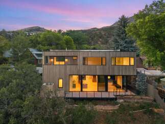 Experience modern living in this stunning architectural home nestled amidst lush greenery and rolling hills.