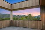 Experience breathtaking sunset views from this modern covered patio, perfect for unwinding or entertaining.