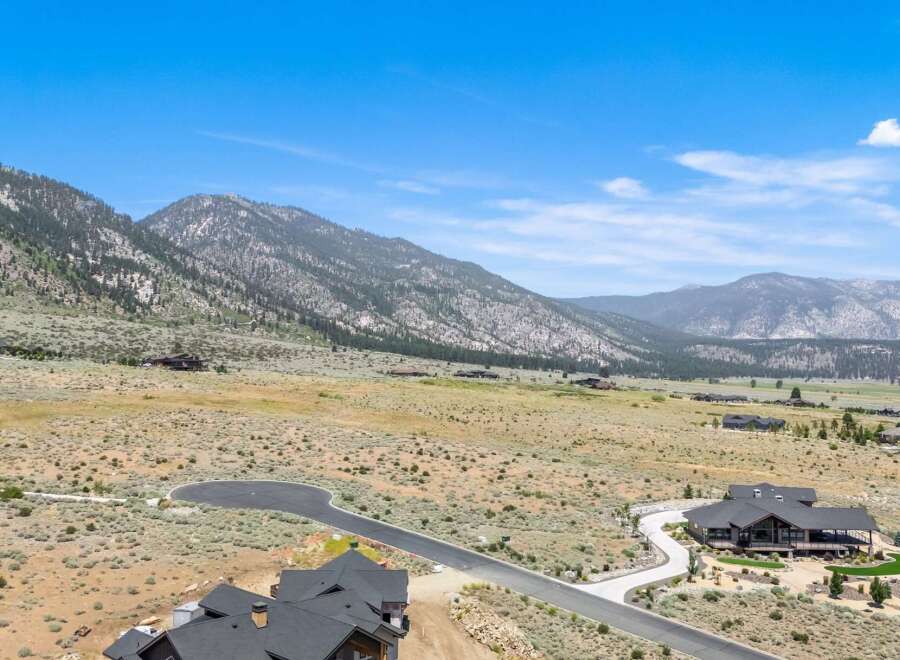 Discover luxury living nestled against a backdrop of majestic mountains.