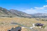 Discover luxury living nestled against a backdrop of majestic mountains.