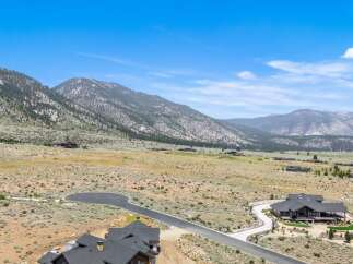 Discover luxury living nestled against a backdrop of majestic mountains.
