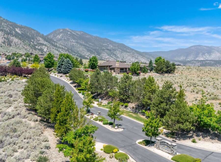 Discover luxury living in this stunning estate nestled against a backdrop of majestic mountains.