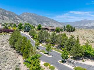 Discover luxury living in this stunning estate nestled against a backdrop of majestic mountains.