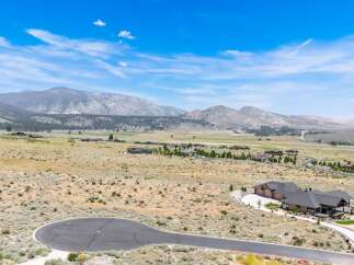 Discover luxury living in this stunning mountain estate, offering breathtaking panoramic views of the surrounding landscape.
