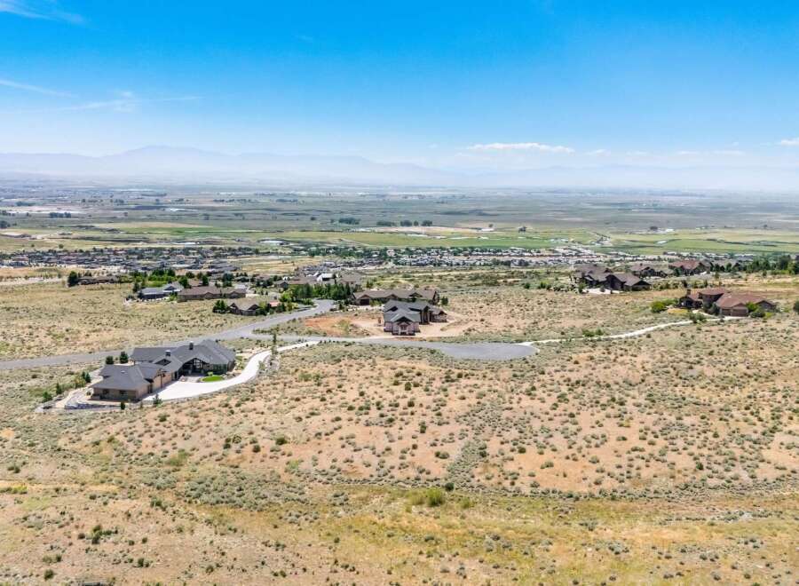 Discover luxury living in this expansive estate, offering breathtaking panoramic views of the valley and distant mountains.