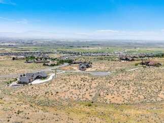 Discover luxury living in this expansive estate, offering breathtaking panoramic views of the valley and distant mountains.