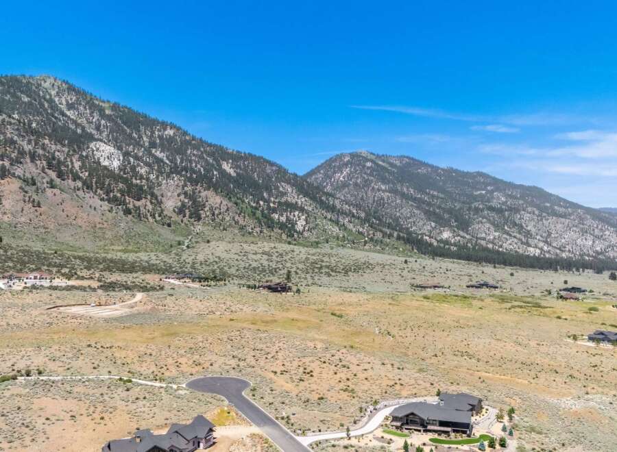 Discover luxurious living nestled against a backdrop of majestic mountains.