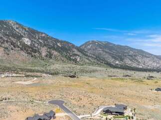Discover luxurious living nestled against a backdrop of majestic mountains.