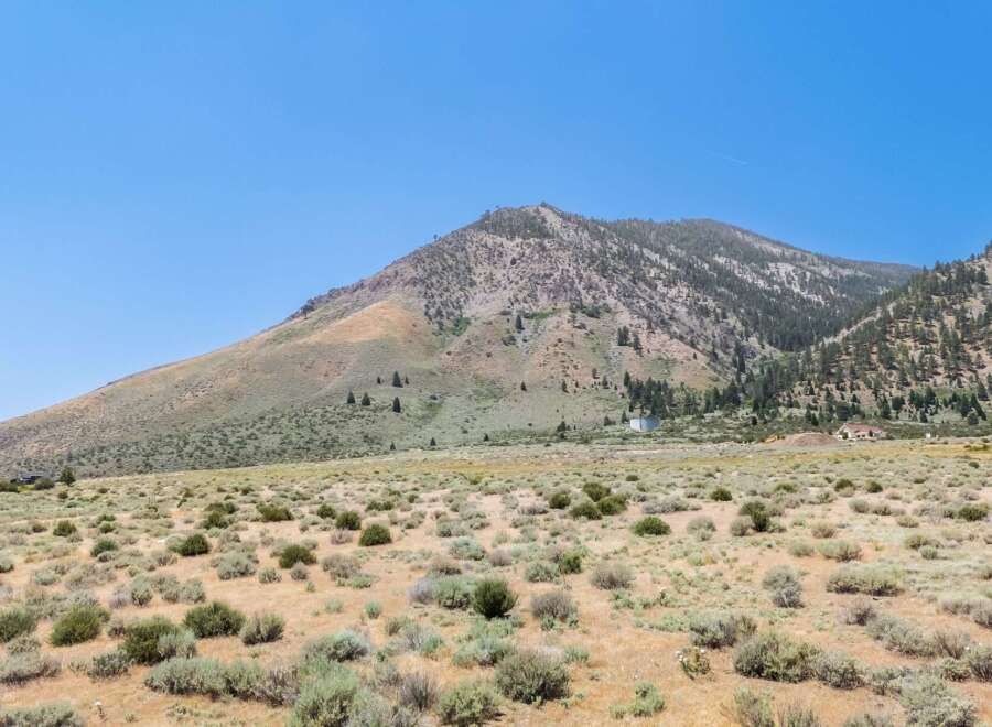 Discover your dream home nestled against a majestic mountain backdrop.