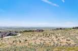 Discover breathtaking panoramic views from this stunning property, offering a serene escape with expansive vistas of the valley and distant mountains.