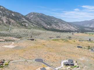 Discover luxury living nestled against a stunning mountain backdrop.