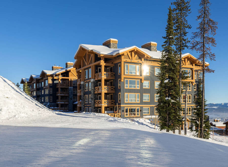 Experience luxury mountain living in this stunning ski-in/ski-out condo, perfectly situated on a pristine snowy slope.