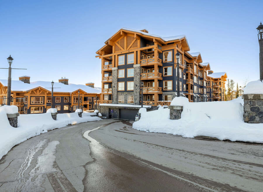 Experience luxury mountain living in this stunning ski-in/ski-out property, featuring a modern alpine design with warm wood accents and stone detailing.
