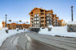 Experience luxury mountain living in this stunning ski-in/ski-out property, featuring a modern alpine design with warm wood accents and stone detailing.